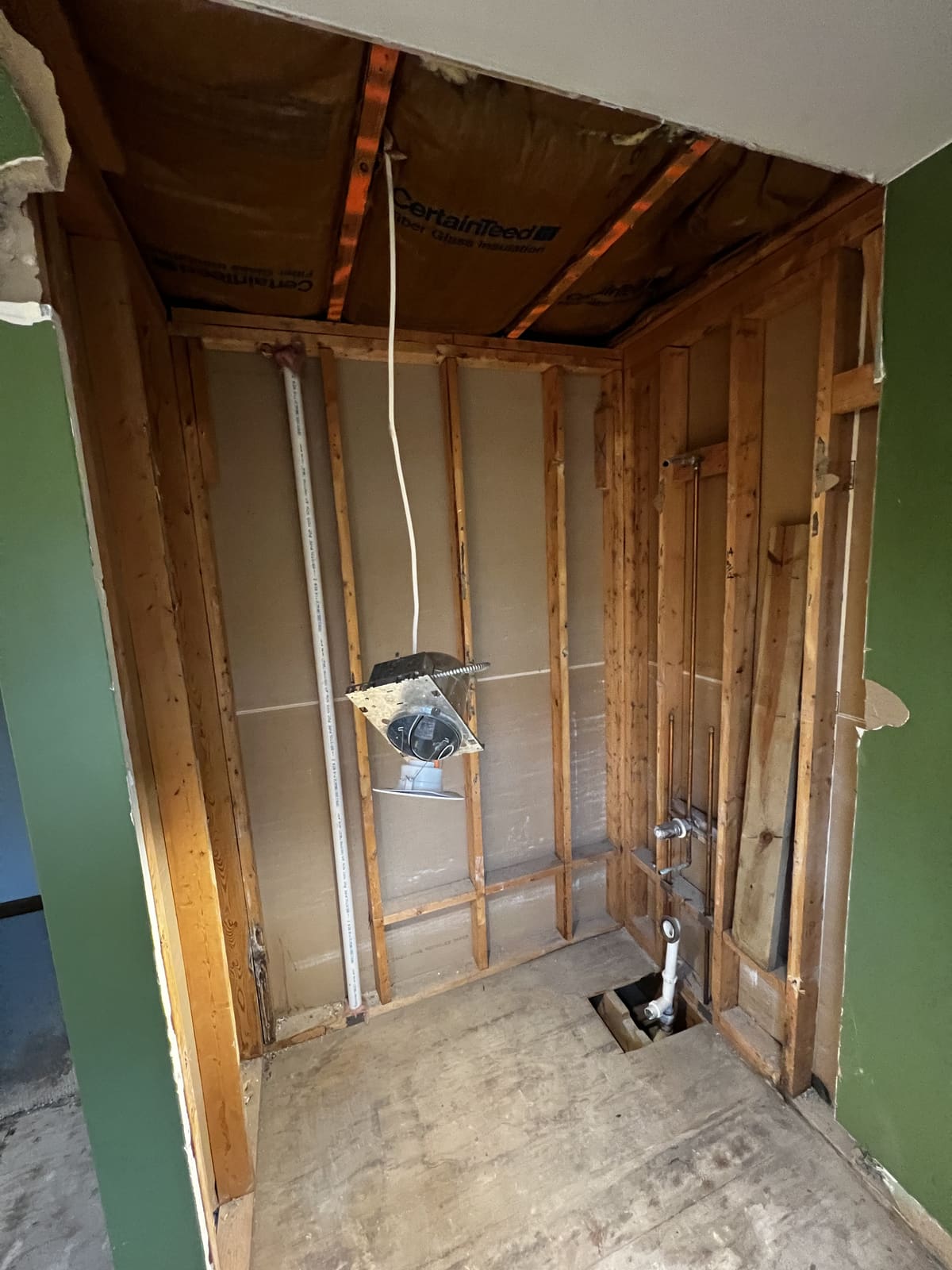 Open wall cavity during selective interior demolition