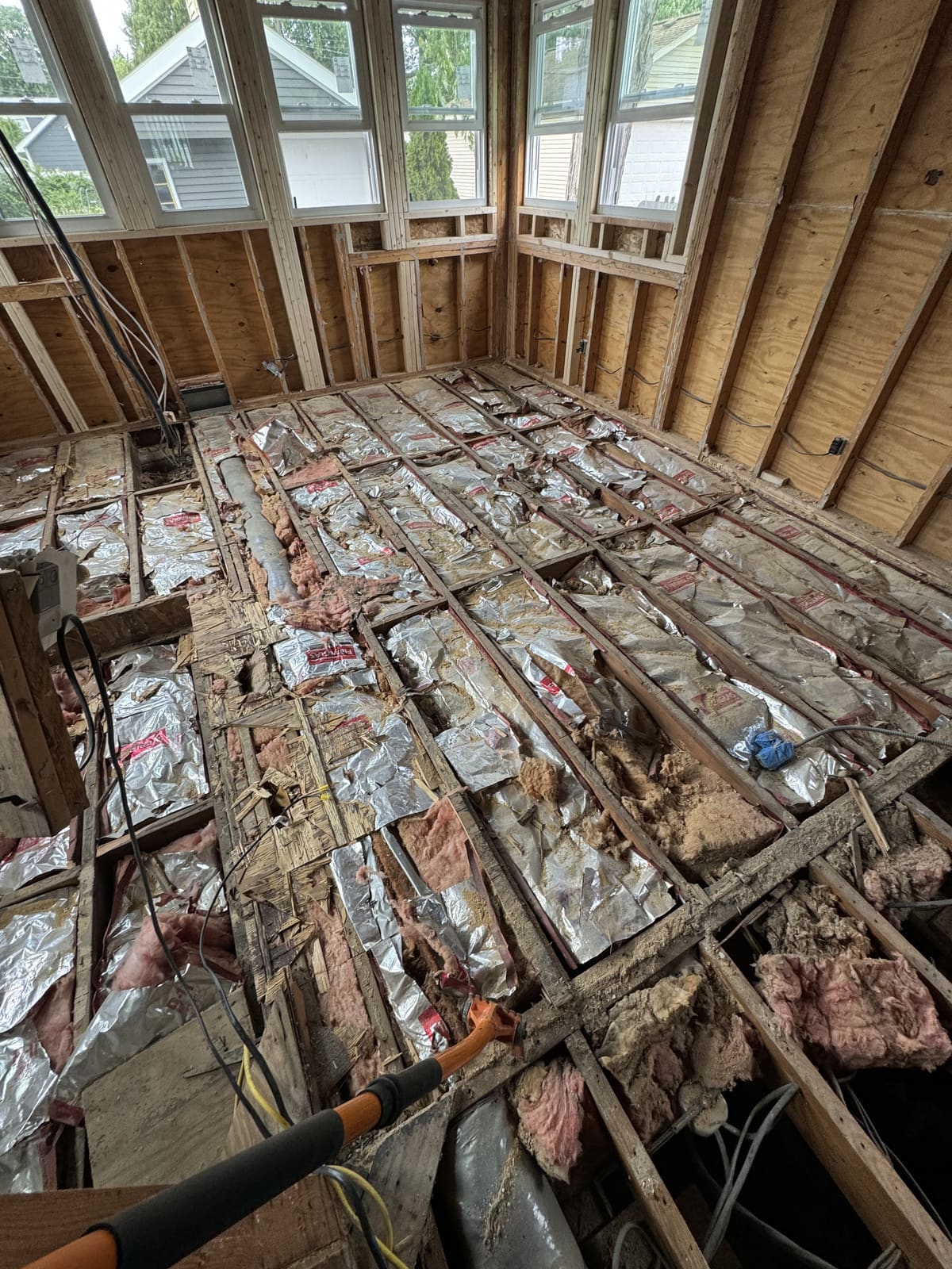 Floor joists exposed after the subfloor was removed
