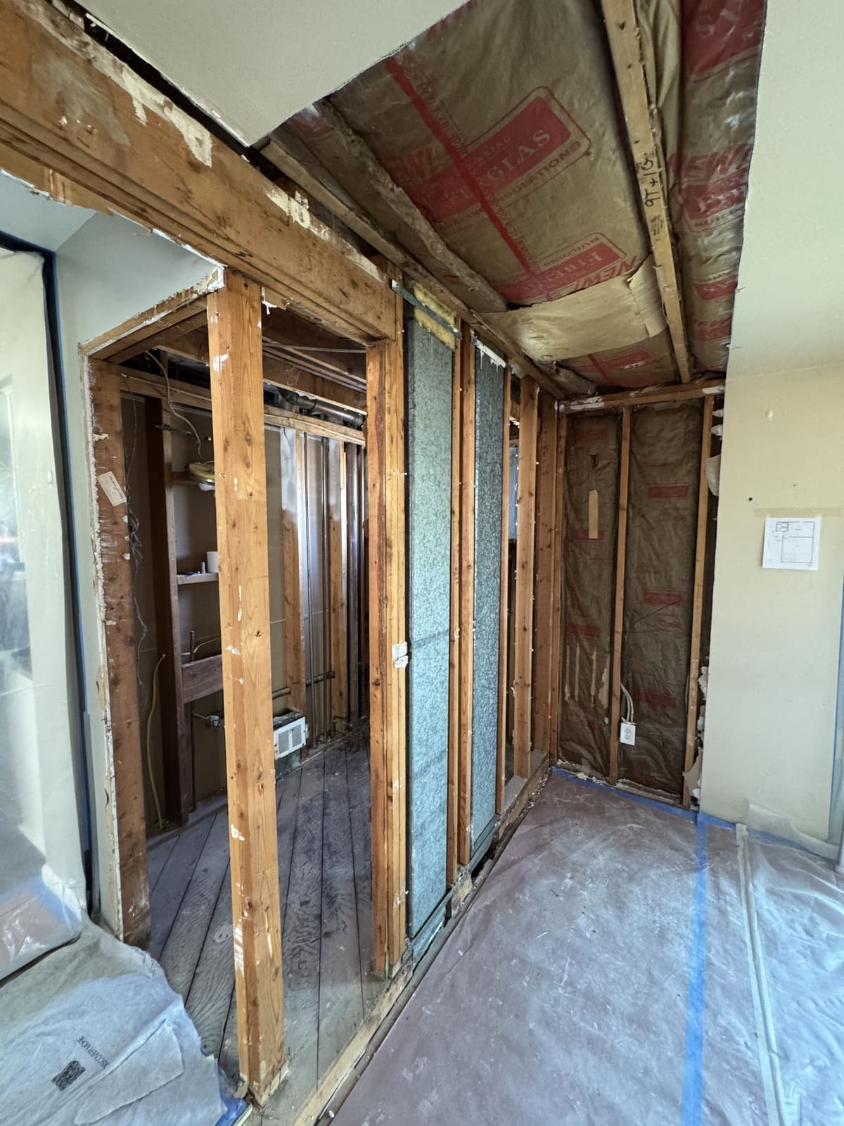 Hallway opened to the framing during interior selective demolition