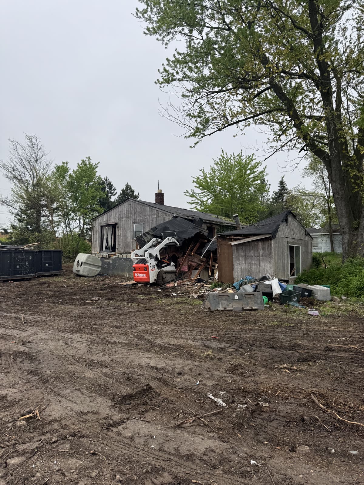 Partly collapsed outbuilding on a residential lot