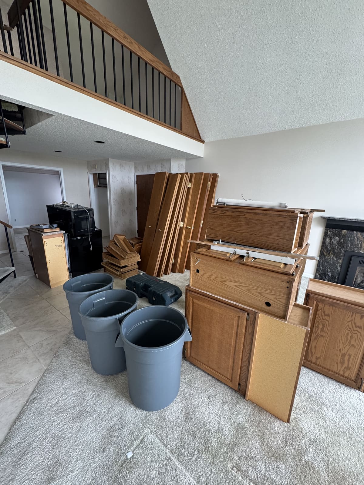 Kitchen cabinets pulled and staged during a kitchen demolition