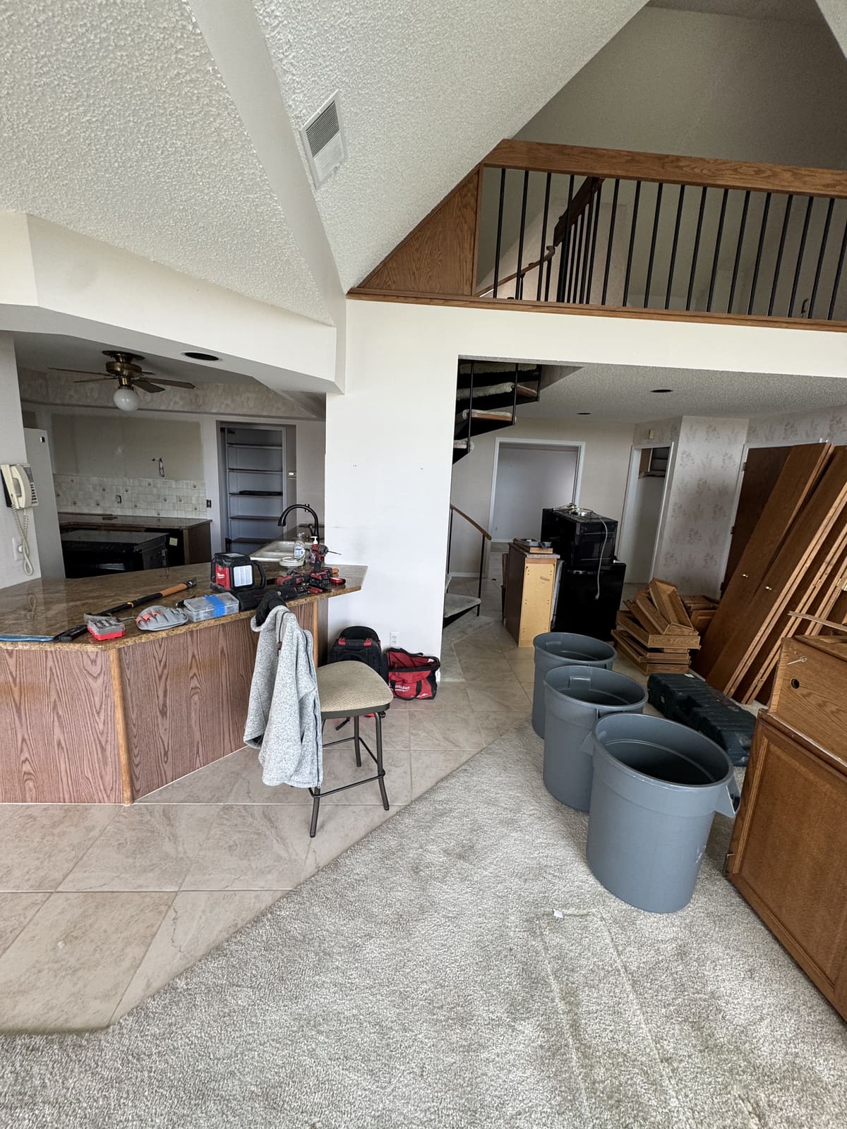 Kitchen island and cabinets removed during a kitchen demolition