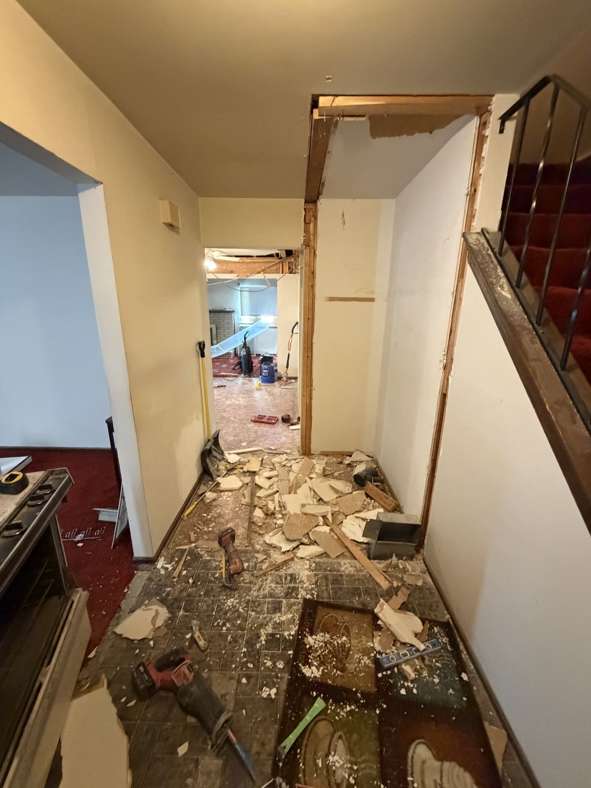 Hallway full of demolition debris during an interior strip-out